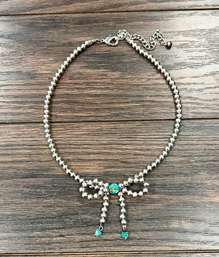 the bow necklace